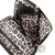 color: Luxurious Black Leather with Leopard Interior; alt: Everyday Small Size Makeup Bag | KUSSHI