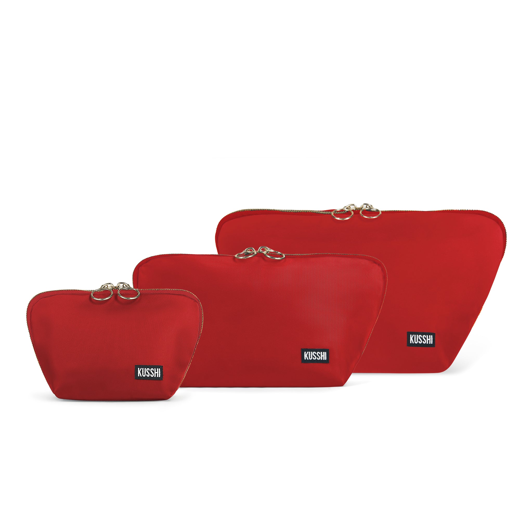 color: Candy Apple Red Fabric with Pink Interior; alt: The Complete KUSSHI Set Makeup Bag | KUSSHI