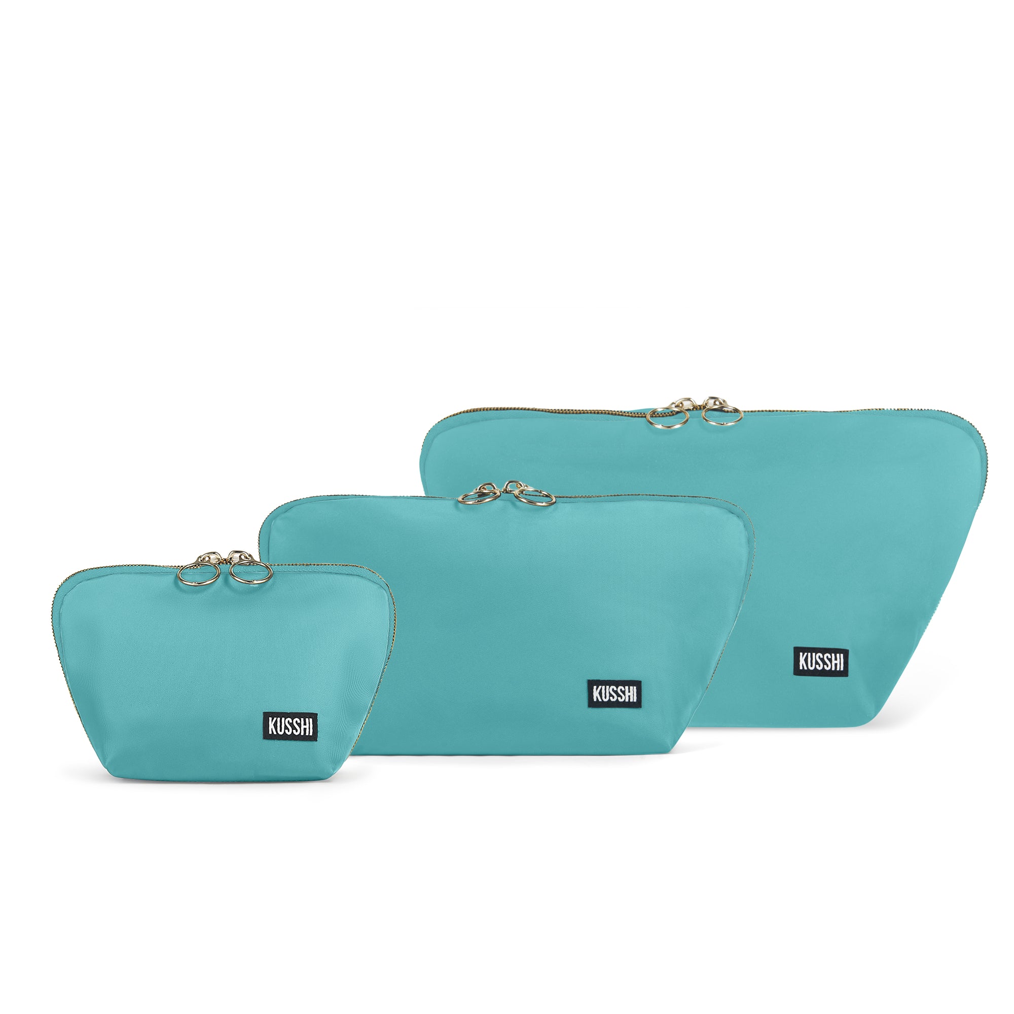 color: Sea Green Fabric with Bright Orange Interior; alt: The Complete KUSSHI Set Makeup Bag | KUSSHI