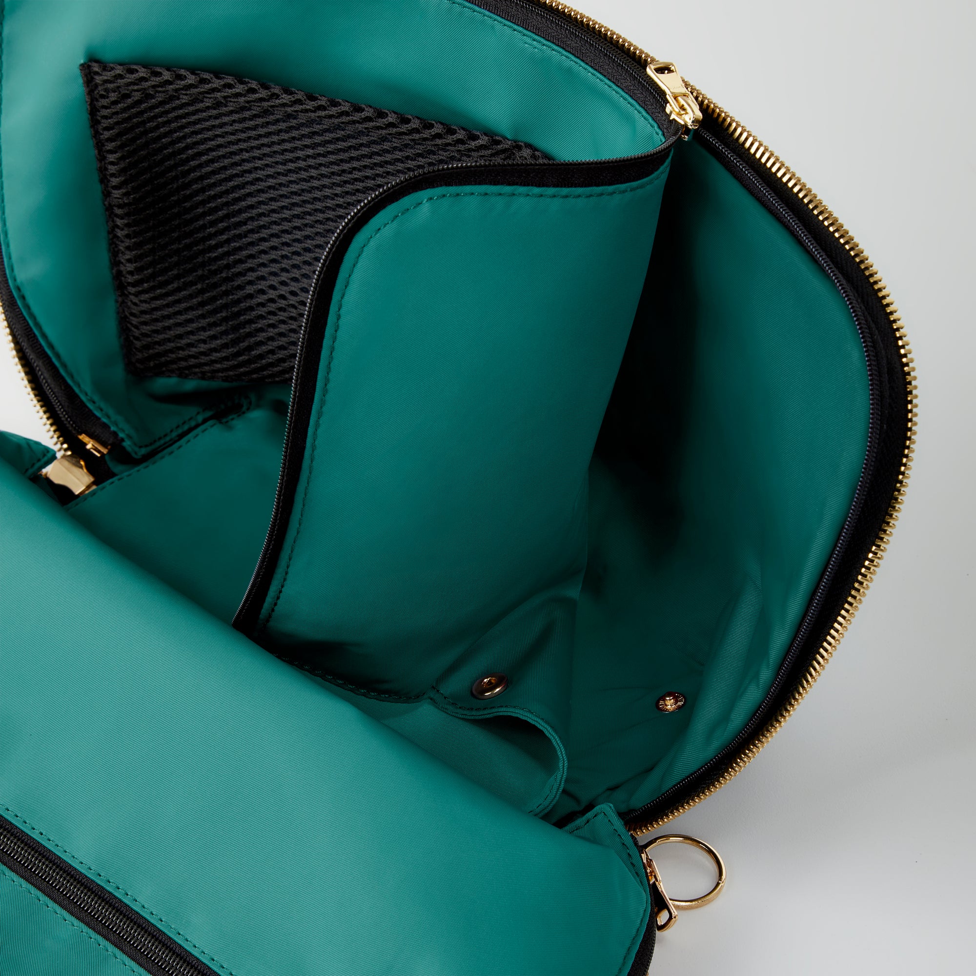 color: Luxurious Black Leather with Emerald Green Interior; alt: Signature Medium Size Makeup Bag | KUSSHI