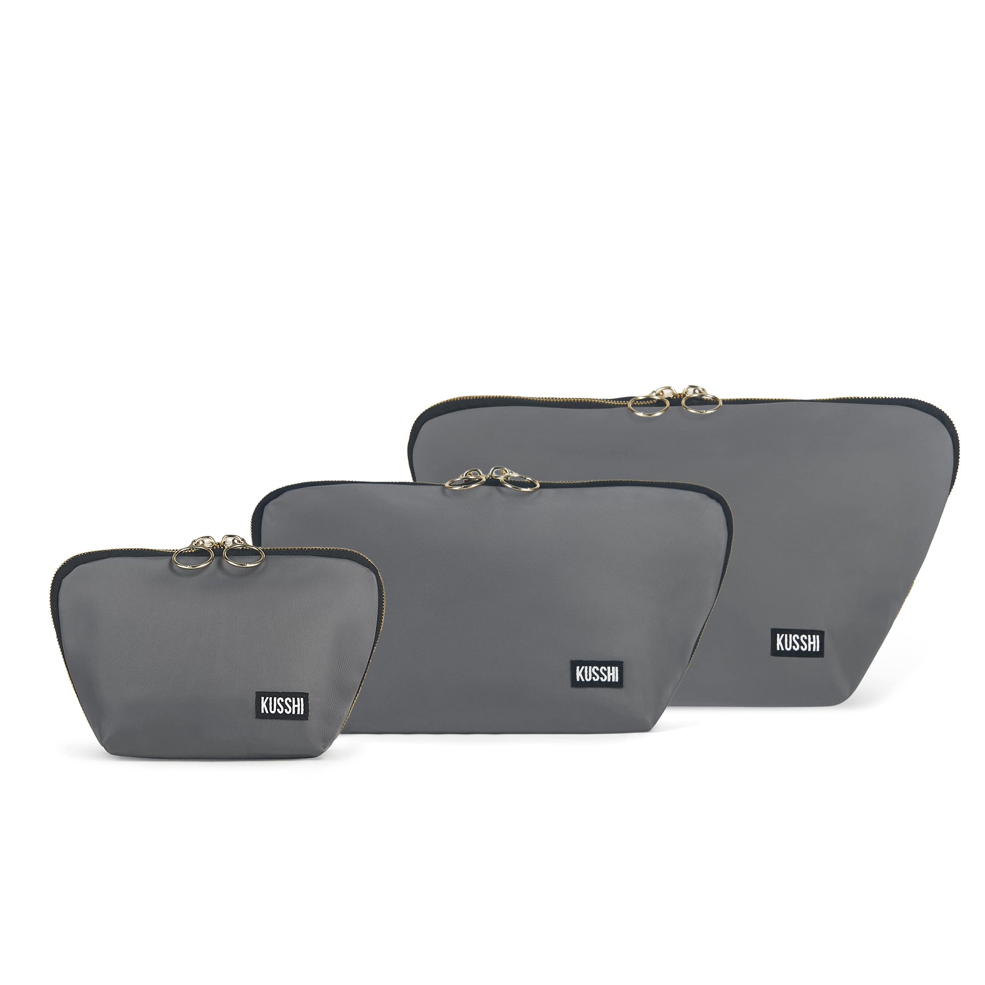 color: Steel Grey Fabric With Purple Interior; alt: The Complete KUSSHI Set Makeup Bag | KUSSHI