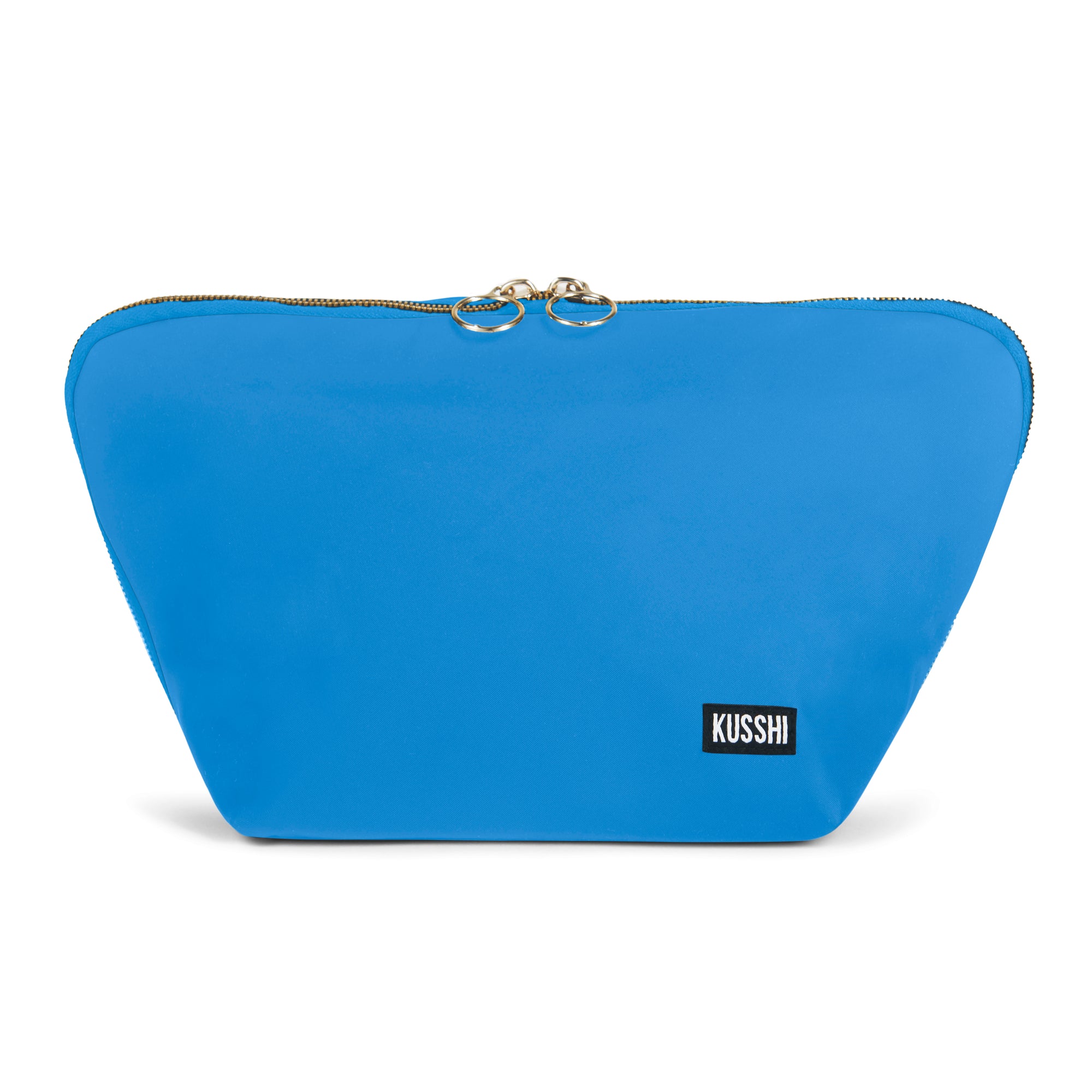 color: Electric Blue Fabric with Neon Pink Interior; alt: Vacationer Large Makeup Bag | KUSSHI