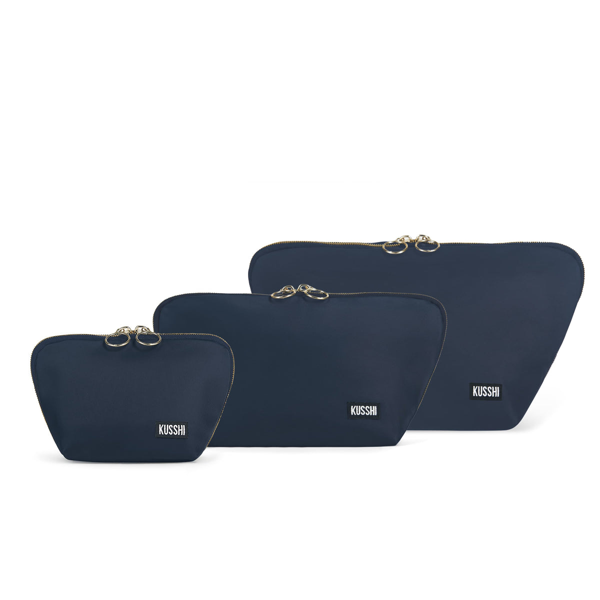 color: Navy Fabric with Pink Interior; alt: The Complete KUSSHI Set Makeup Bag | KUSSHI