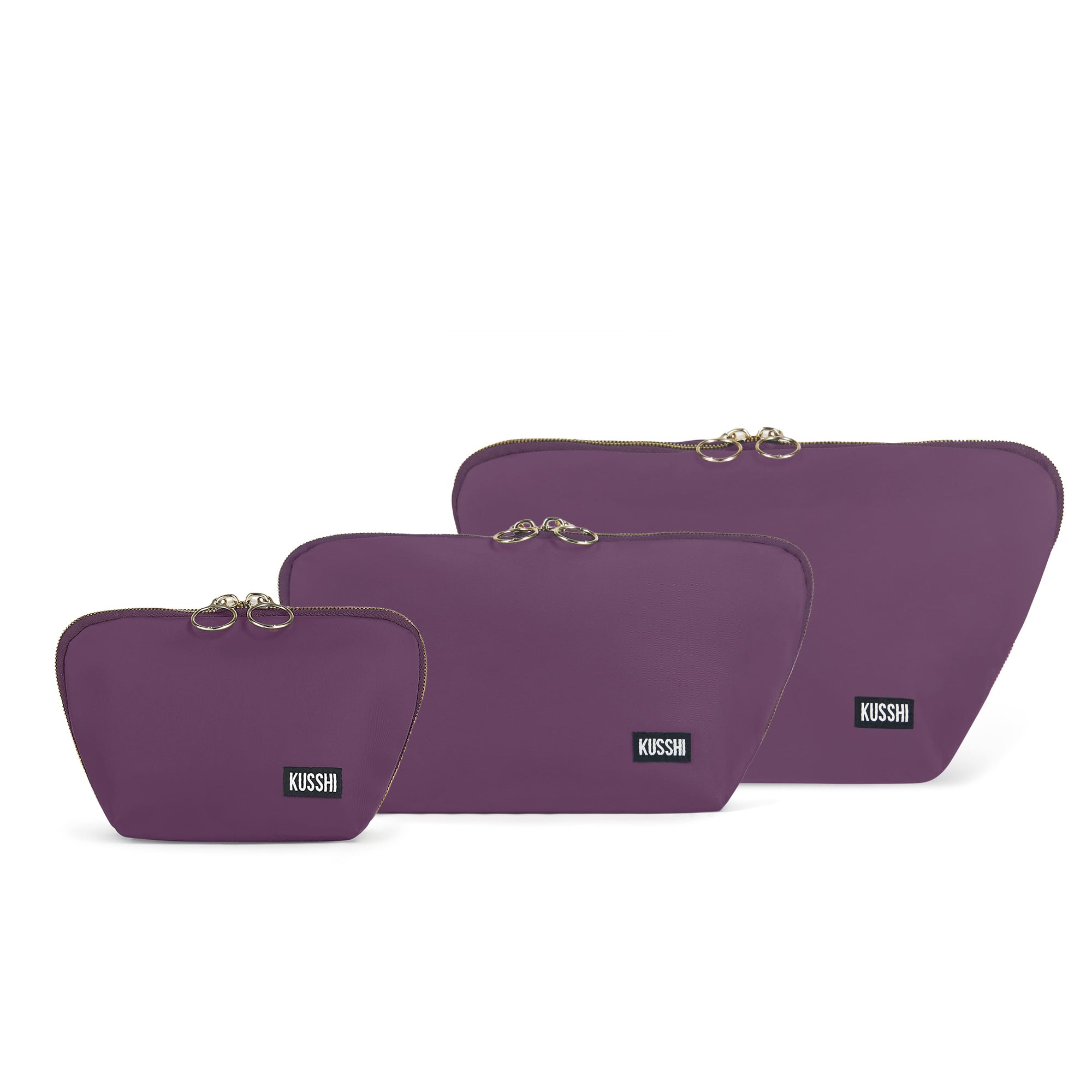 color: Plum Fabric with Dusty Rose Interior; alt: The KUSSHI Complete Set Makeup Bag | KUSSHI